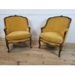 Pair of Edwardian walnut arm chairs.