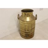 Brass double handed milk churn.