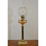 Victorian oil lamp on brass column.