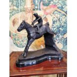 Bronze model of a horse and jockey.