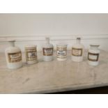 Collection of six early 20th C. opaline glass chemist jars.