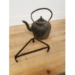 Early 20th C. cast iron kettle and wrought iron trivet.