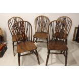 Set of five ash wheel back kitchen chairs.