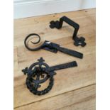 Three early 20th C. wrought iron pieces of door furniture.
