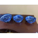 Graduated set of three blue and white ceramic dishes