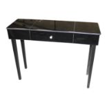 Smoked glass side table with single drawer.