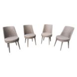 Four round grey upholstered side chairs.