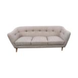 Deep buttoned grey upholstered three seater sofa.