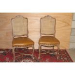 Pair of side chairs with bergere backs and leather upholstered seat