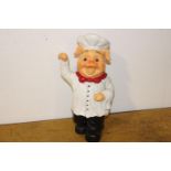 Small model of pig dressed as a Chef.