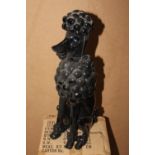 Model of a seated Poodle