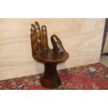 Wooden seat in the form of a hand with ivory painted nails