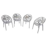 Set of four decorative branch design perspex chairs.