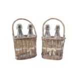 Pair of baskets each with two bottles