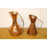 Set of two brass and copper jugs.