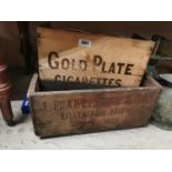 Two wooden advertising boxes