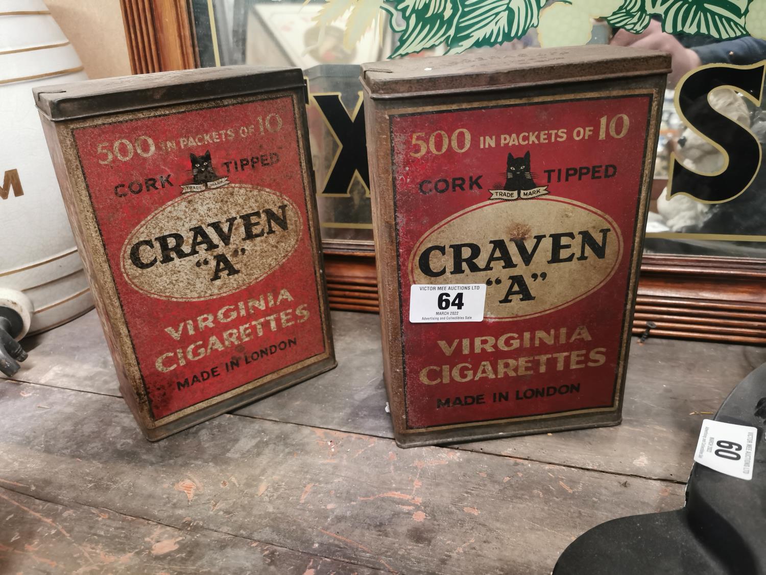 Two Craven A cigarette advertising tins.