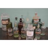 Collection of fourteen 19th C. Glass chemist bottles.