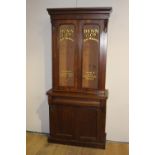 Two door glazed Dunn and Co mahogany shop display cabinet
