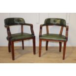 Pair of Green leather armchairs.
