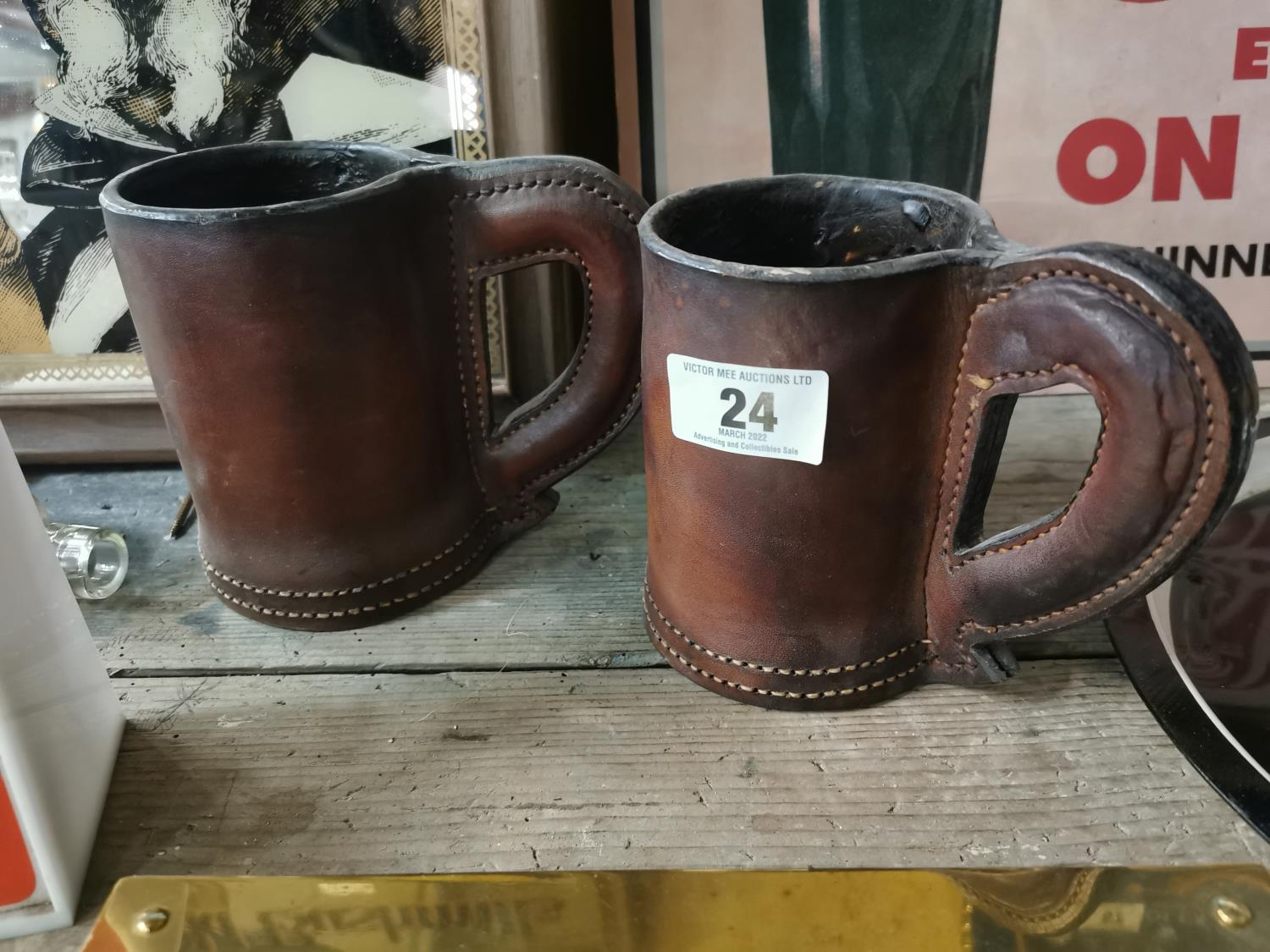 Two leather drinking vessels.