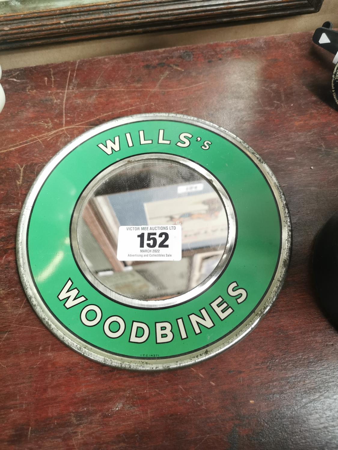 Wills Woodbine circular advertising mirror.