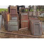 Large collection of mahogany shop cabinet doors and panelling.