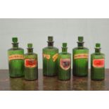 Collection of six 19th C. Green glass chemist bottles.
