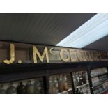 J McGeough shop sign.