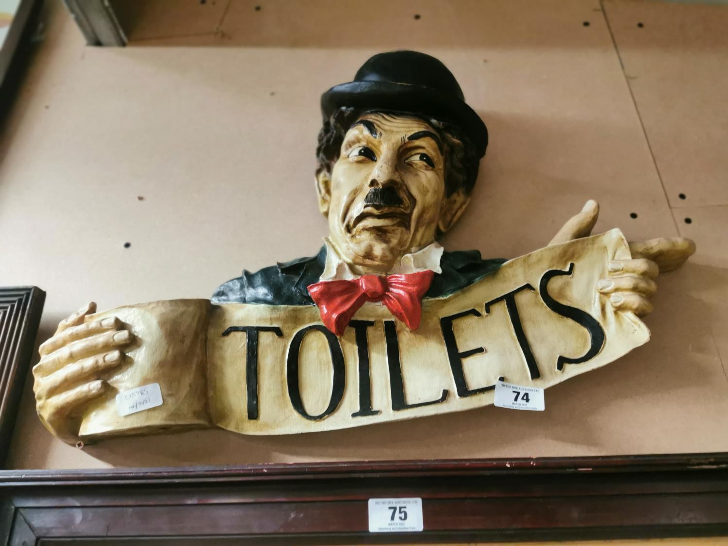 Plaster wall plaque Toilet sign depicting Charlie Chaplin