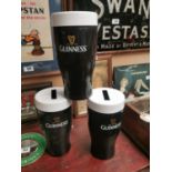 Three large Guinness advertising novelty money boxes