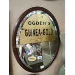 Framed oval Ogden's advertising mirror