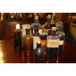 Miscellaneous lot of eleven glass chemist bottles.