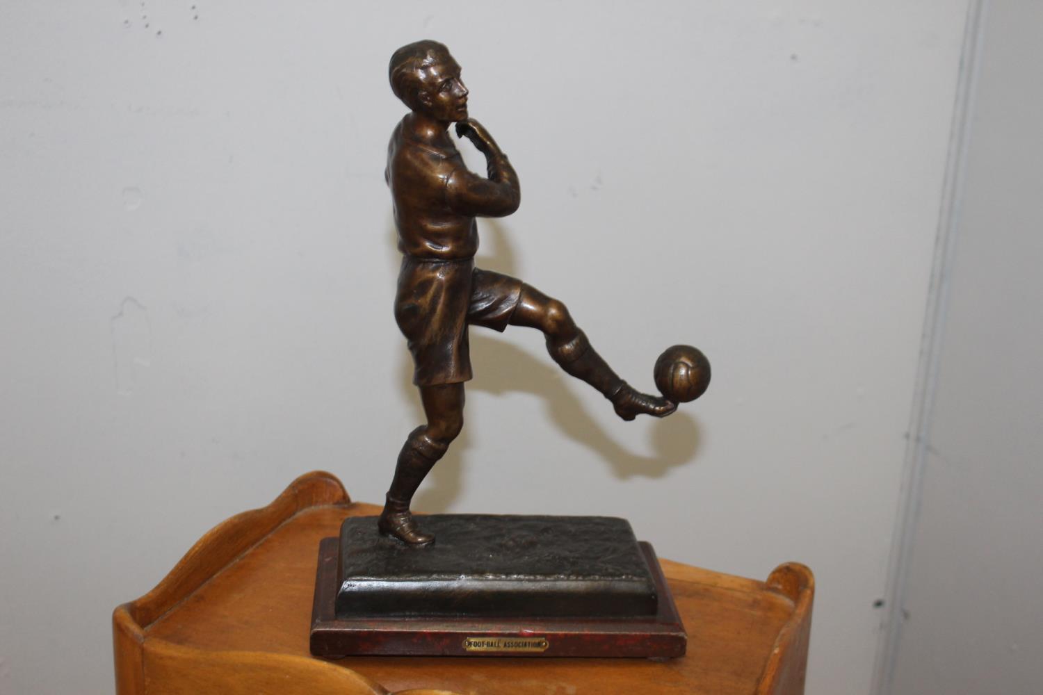 Bronze model of Footballer