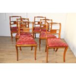 Set of four plus two leather upholstered deep buttoned dining room chairs.