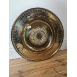 Early 20th C. embossed brass charger.