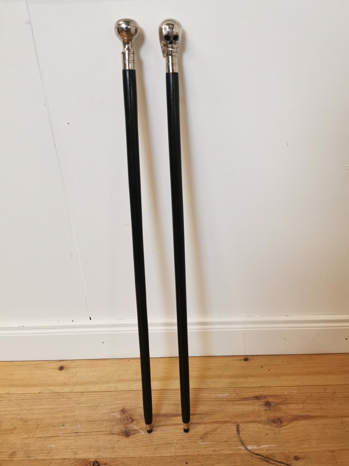 Two ebony and polished steel walking sticks. - Bild 2 aus 2