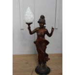 Bronze lamp in the form of a Lady holding torch on marble base.