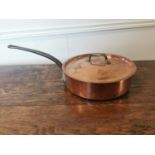 Good quality copper and metal lidded saucepan.