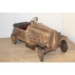Early metal child's pedal car with leather seat and back