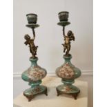 Pair of gilded metal and ceramic candlesticks. {