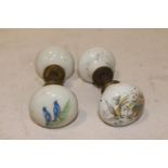 Two ceramic and brass door knobs