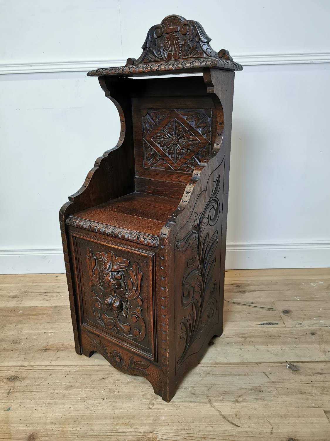 19th C. carved oak coal locker decorated with Lion's mask