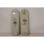 Two ceramic door plates