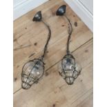 Pair of wrought iron and hand blown glass lanterns.