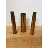 Three WWI brass gun shells