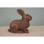 Cast iron model of a seated Rabbit.