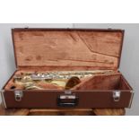 Cased Yamaha saxophone.