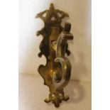 Large brass scroll decorated door knocker