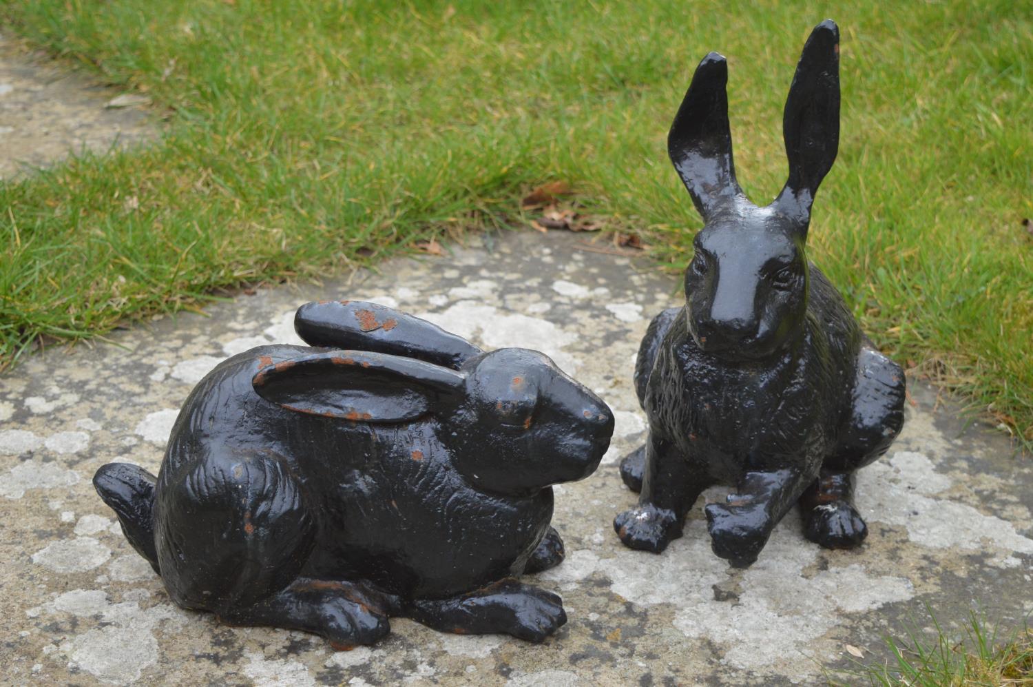 Pair of cast iron models of seated Rabbits.